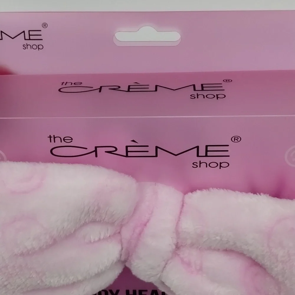 the Crème Shop teddy headband pink with smiley faces plush spa